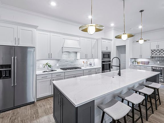 Open concept kitchen with stainless steel appliances