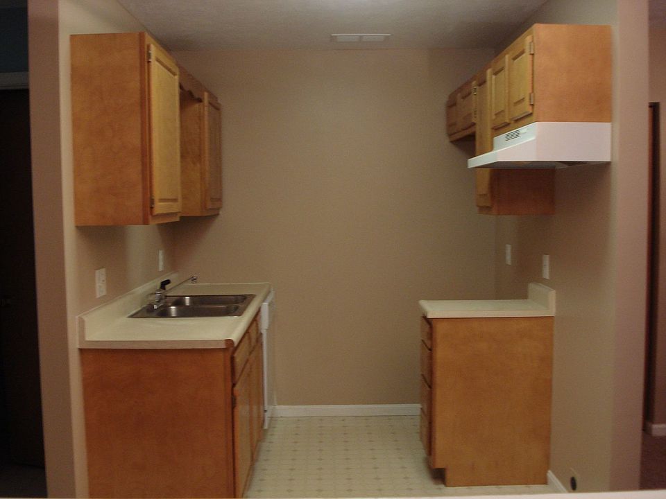 Oak Cabinets, Stainless Steel Sink Kitchen with Eat In area