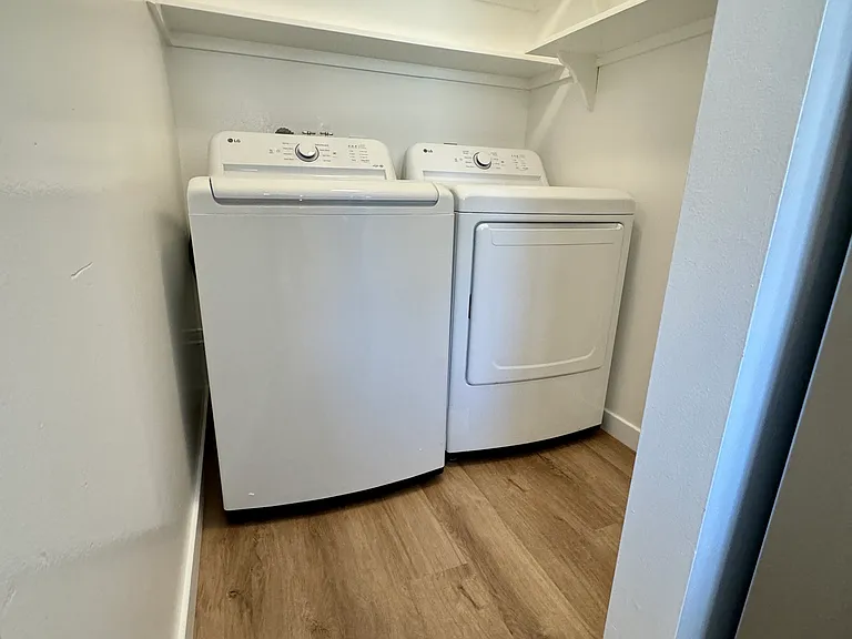 Separate laundry room with new Washer & Dryer and an abundance of storage!