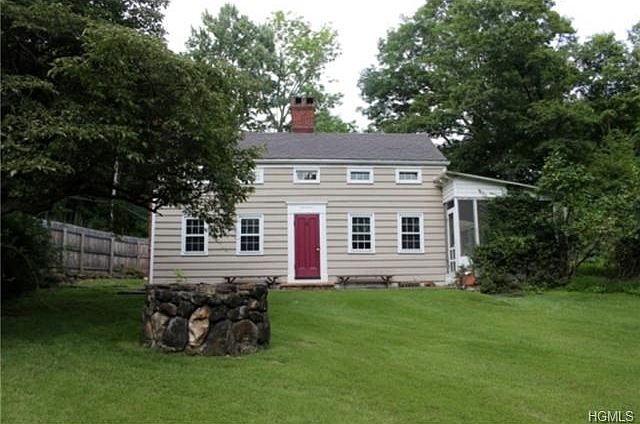 Charm filled 1840's colonial. Front slate patio and enclosed side porch.