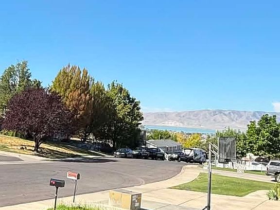 Stunning view of Utah Lake from the front yard in quiet neighborhood.