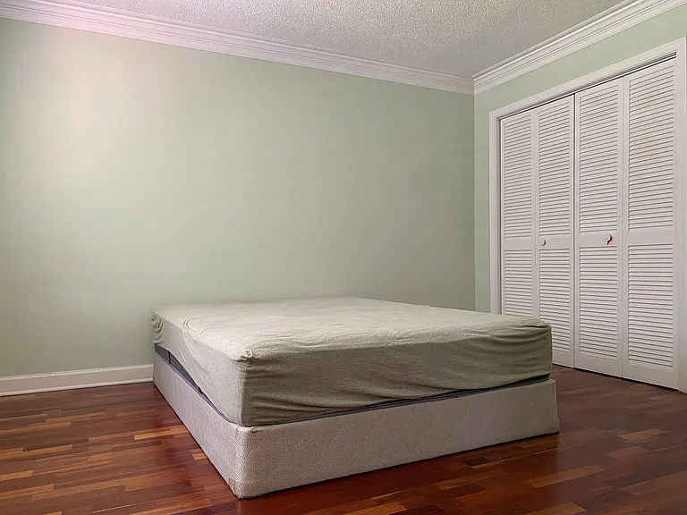 Spacious primary bedroom featuring a comfortable layout and generous closet space