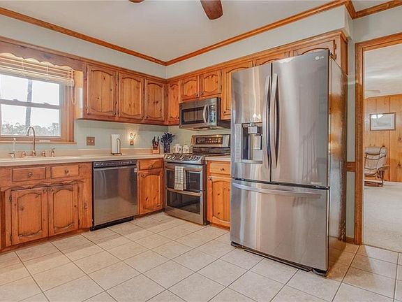 Corian counter tops, ceramic tile floors and backsplash, newer Energy Star Appliances, tons of cabinets!
