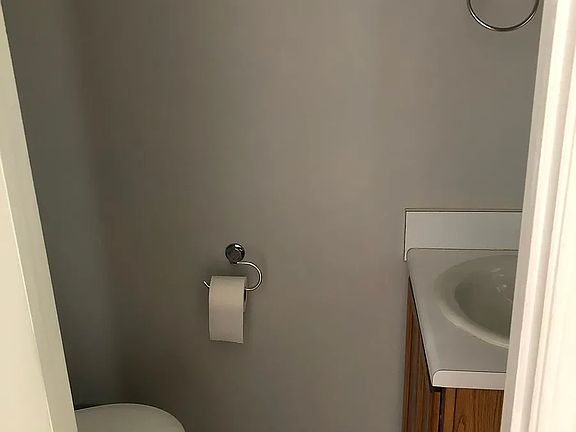 Half bath located by living room and kitchen