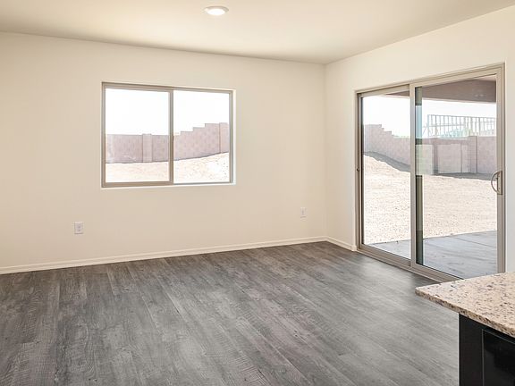 Dining area with a great view of the back patio through the glass sliding doors.