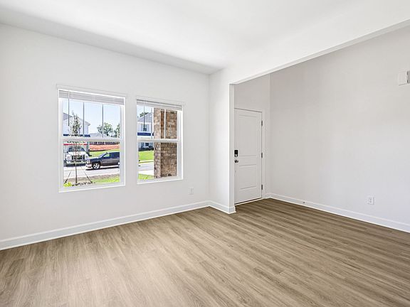 The flex room makes for a perfect entry seating area or home office.