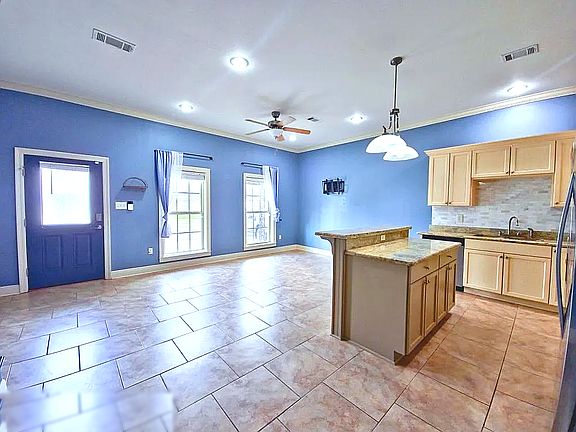 Kitchen and living room area on first floor with kitchen island