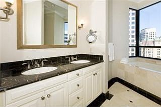 Marble baths with extra deep soaking tubs & separate showers 