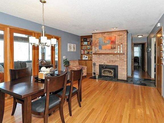 Cozy fireplace with insert for long log burn.