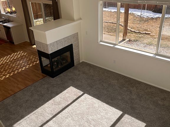 Vaulted living room with gas fireplace