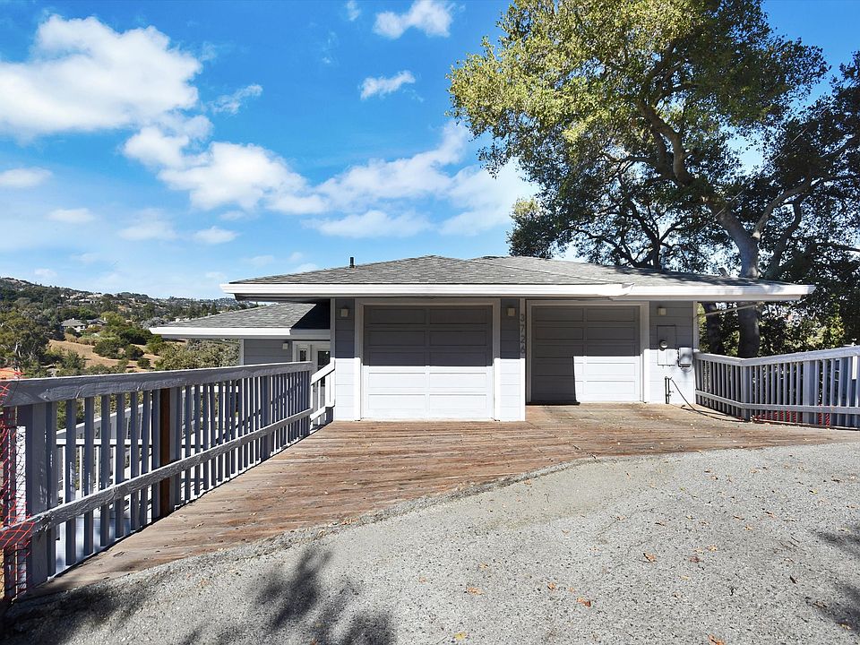 Driveway and two car garage with separate electrical doors.