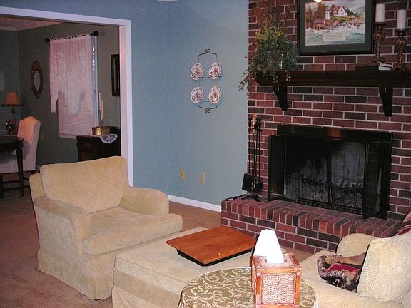 Adjoining Living Room & Dining Room with Fireplace