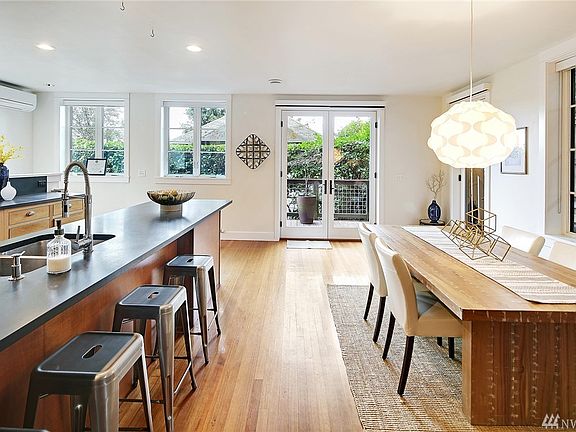 Spacious Dining Area in additional to barstool seating in the kitchen and easy deck access.