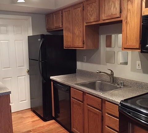 Fully equipped kitchen which includes refrigerator, dishwasher, stove and microwave.