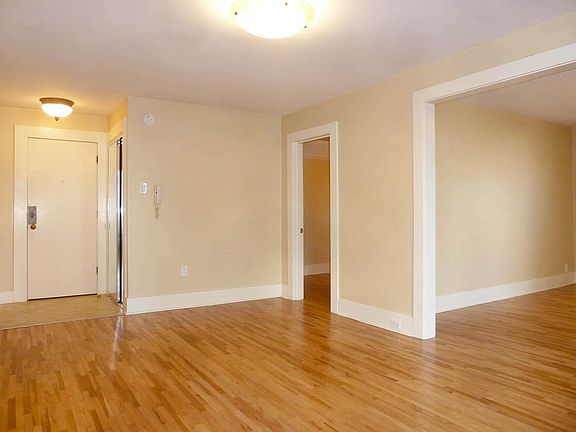 Entry features coat closet with mirrored slider. Secured-entry intercom.