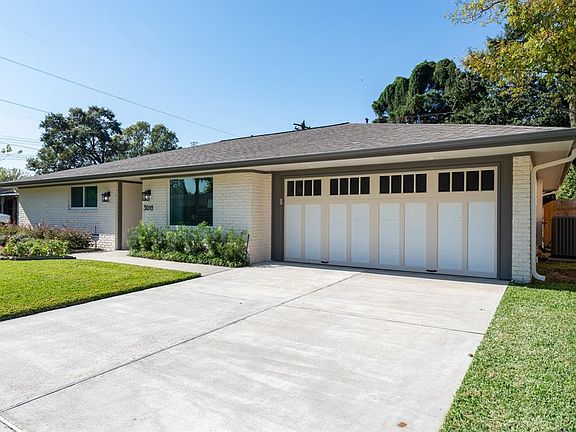 Alternate view: Garage updated with a double garage door larger (accommodates larger vehicles). Home has been updated with a 4 ton/16 seer AC system, 2 tankless water heaters, new duct work. The sidewalk, driveway and patio were repoured with fresh c