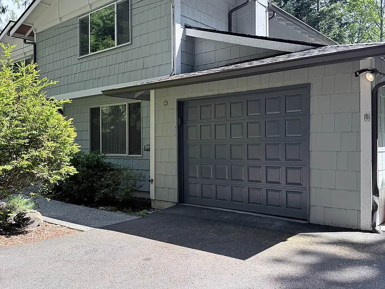 Attached garage provides convenient parking and extra storage space.