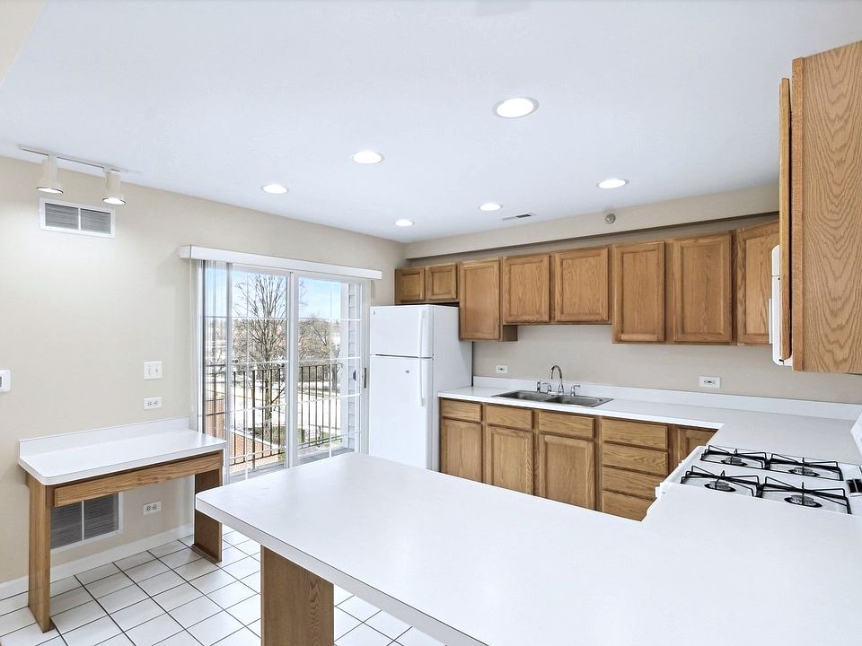 Kitchen with Bar, Work Station & Balcony.