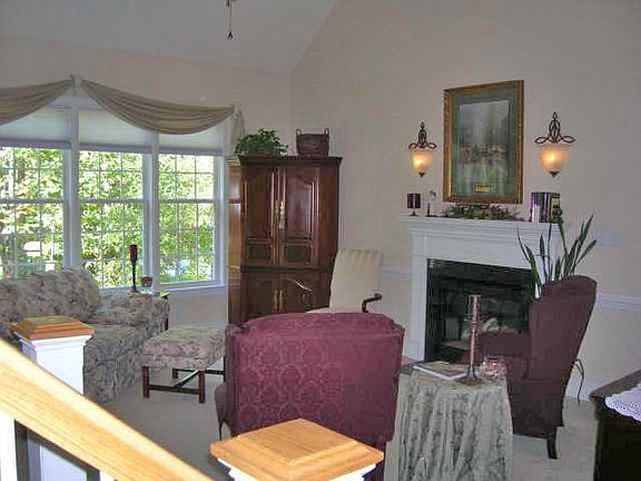 Relax in style in the living room with gas fireplace and cathedral ceilings