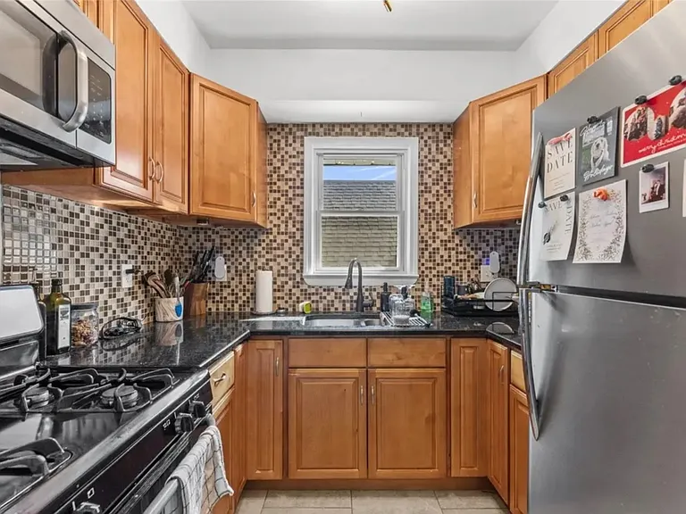 Complete kitchen with full size appliances: fridge, gas range microwave