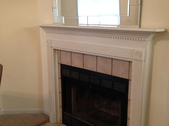 Fireplace & vaulted ceiling in living room