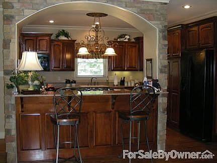 Fabulous kitchen with rock arch bar!
						:
						Double ovens, 5 burner gas cooktop, custom pantry, quartz countertops!