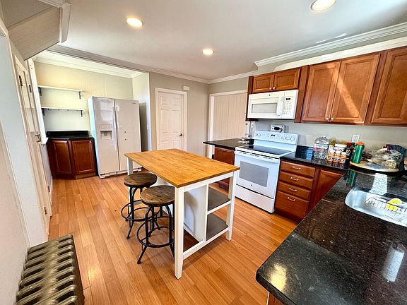 Modern kitchen, center island comes with the property.