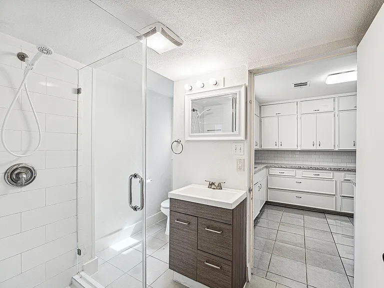 Downstairs Full Bath with Glass paneled shower (just off kitchen)