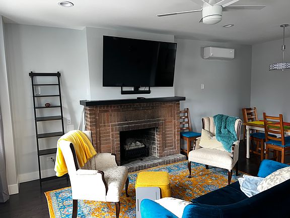 TV drops down so you can place it at a viewing height that is comfortable for you. Electric fireplace provides ambiance, warmth if you want, and it crackles!