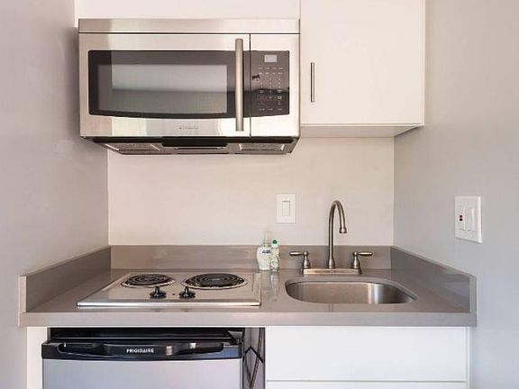 Prepare meals with your two burner stove top and well stocked utensils.