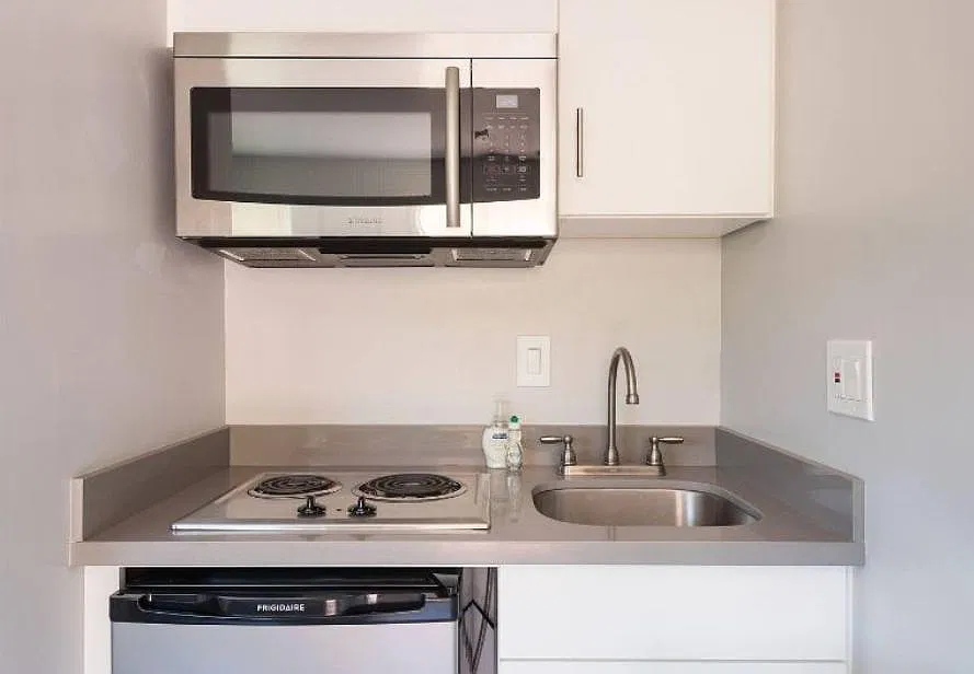 Prepare meals with your two burner stove top and well stocked utensils.