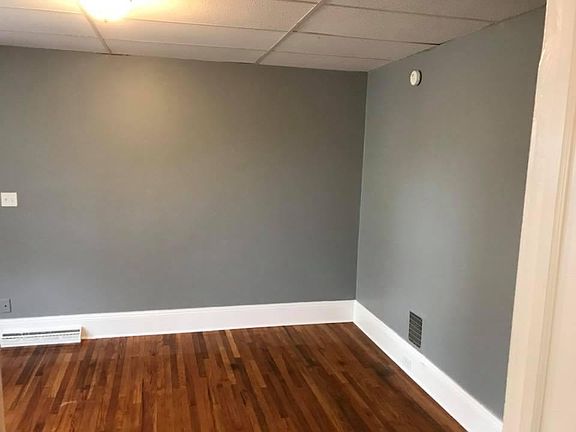 The front room of the house features a bay window.