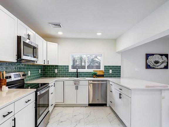 Light and bright kitchen with stainless steel appliances