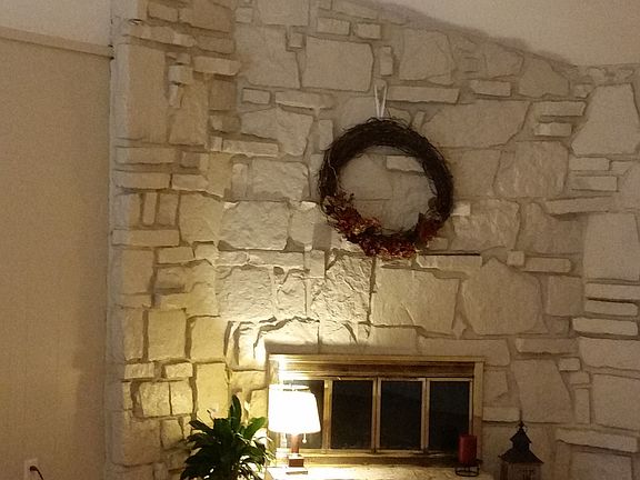 Living room with fireplace & vaulted ceiling