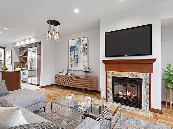 Living room with gas fireplace and media nook. (second floor)