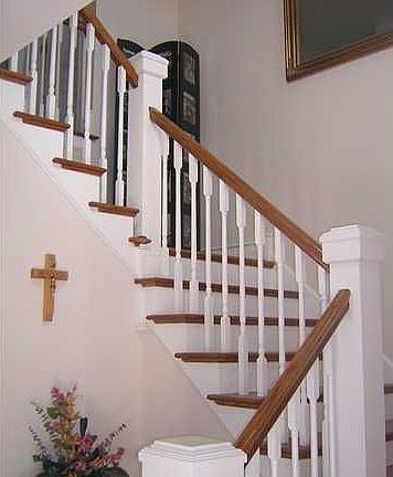 Home opens to this beautiful staircase