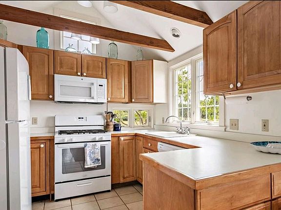 Kitchen, open to dining/living.