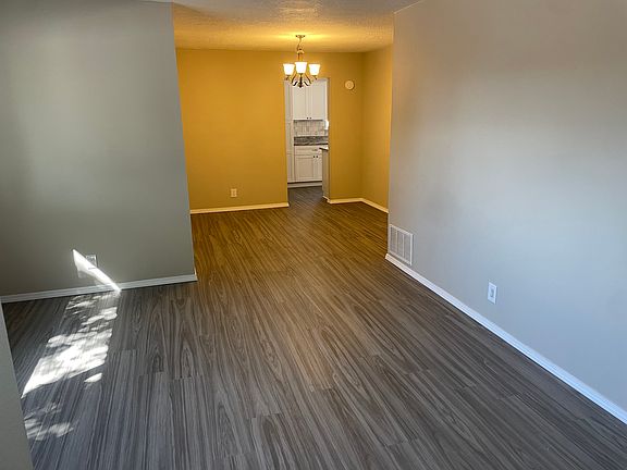 First living space off of the entry way that leads into the dining room and then the kitchen