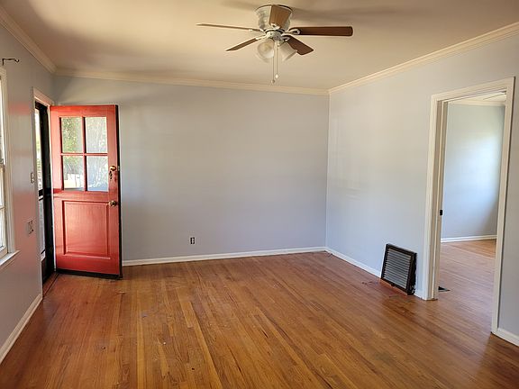 front door to living room, ceiling fan