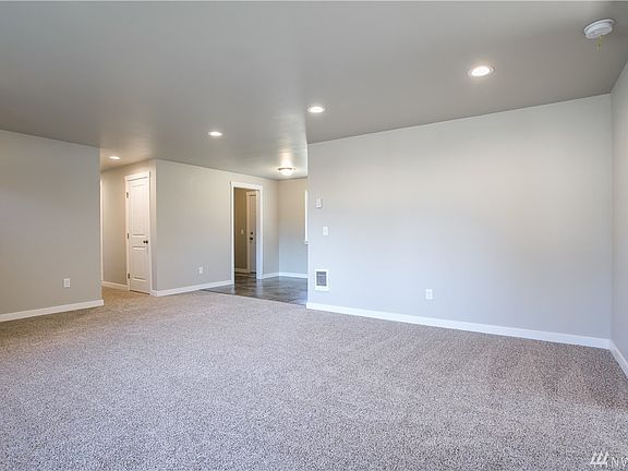 New carpet and interior paint shine through-out the living room and into the dining area. 
