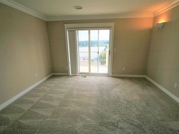 2nd master bedroom with private bathroom, closet, shared deck and view