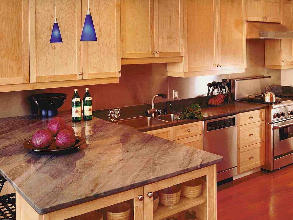 Kitchen with professional stove, double dishwasher, limestone counters