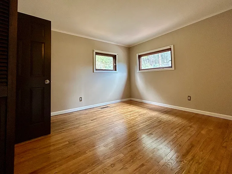 Bright, sunny Master bedroom attached to bathroom