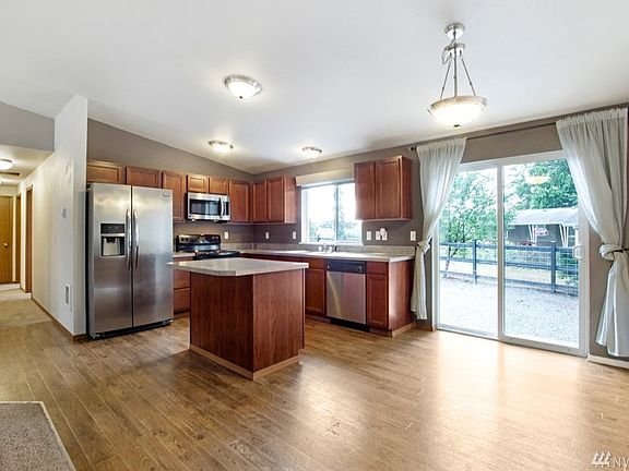 Kitchen with stainless steel appliances. 