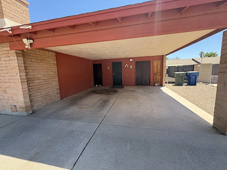 Two car carport with storage area