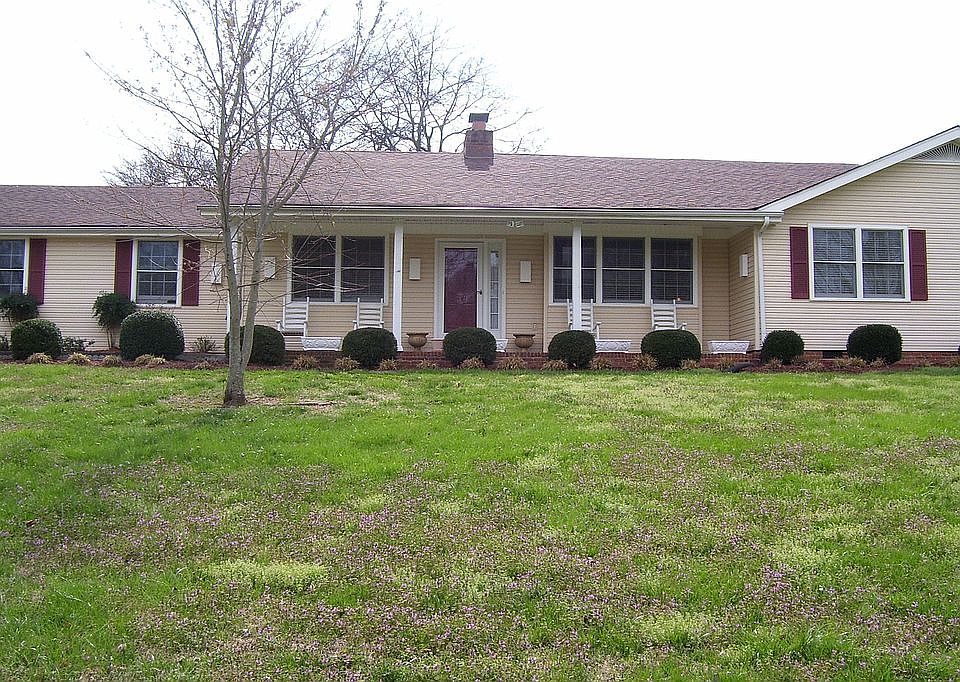 .9 acre lot with mature trees and landscaping 