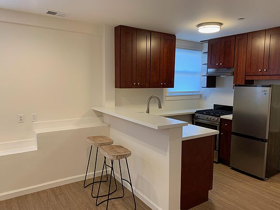 Living Area, Breakfast Bar and Kitchen