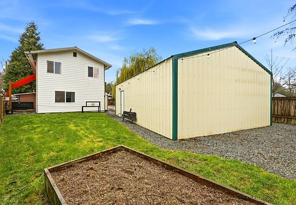 Raised garden bed and detached garage/shop