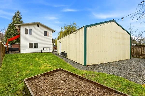 Raised garden bed and detached garage/shop