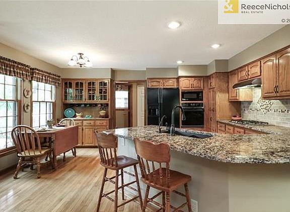 Large Eat In Kitchen & Hearth Room with Brick Fireplace!
